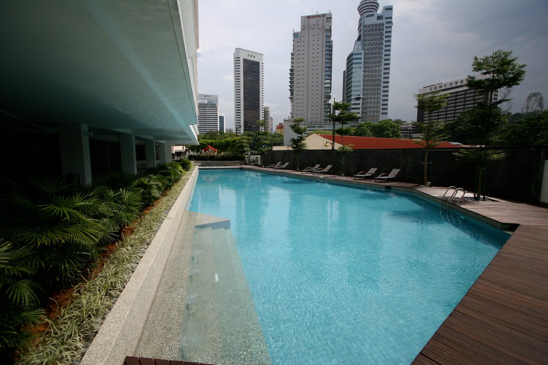 Swimming pool with the KLCC skyline behind